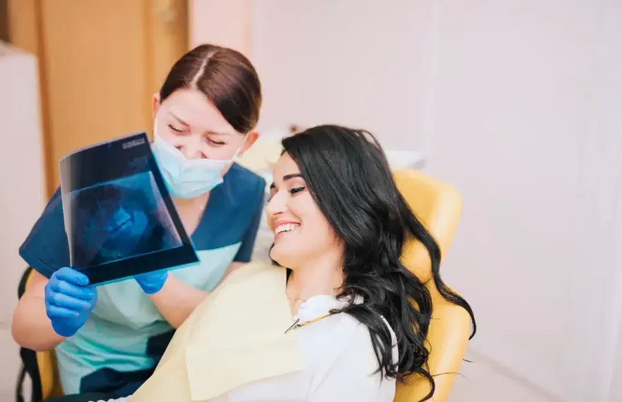 Dentist explaining an X-ray to a patient